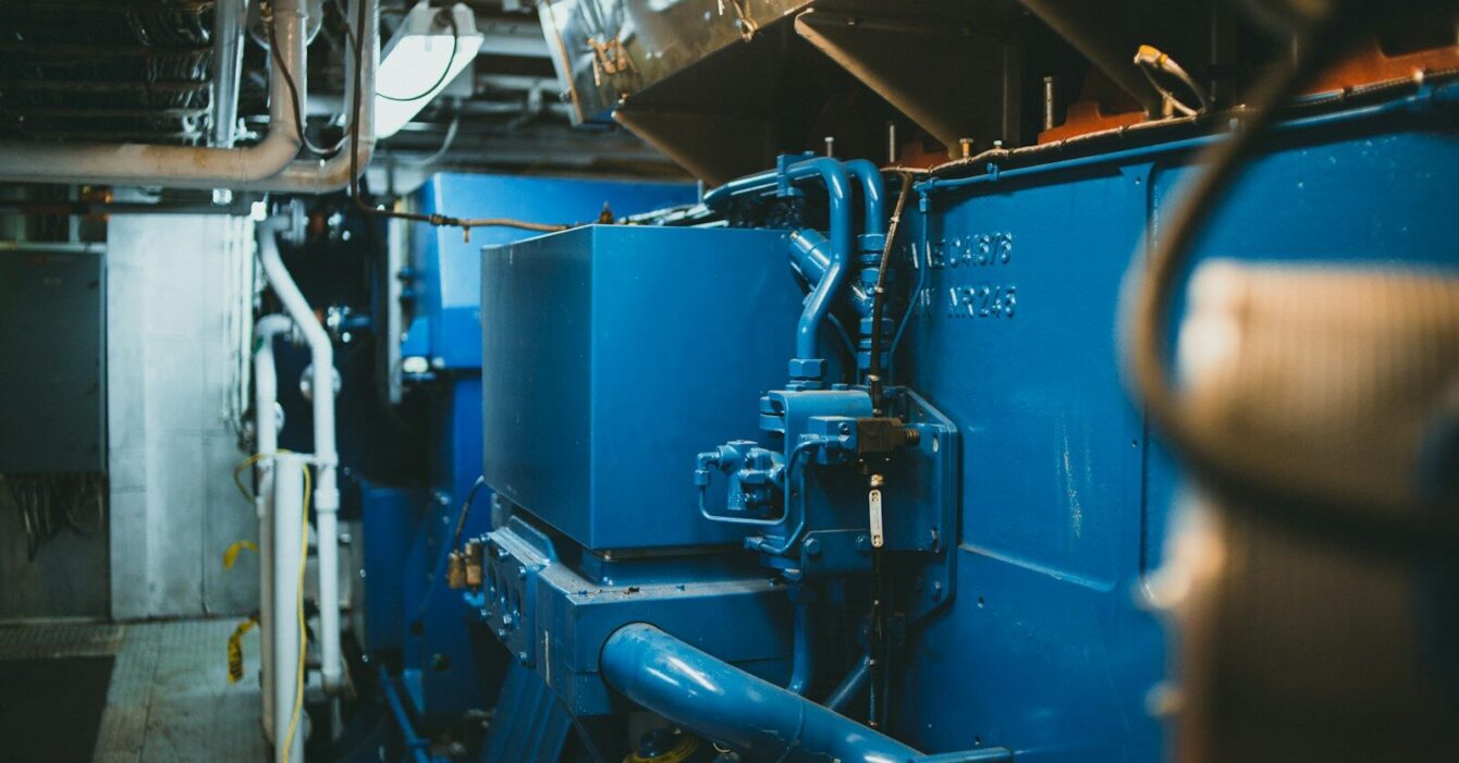 Photo by Jonathan Cooper a large blue machine in a large room