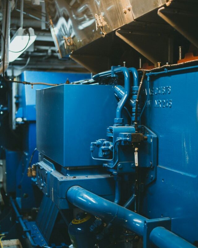 Photo by Jonathan Cooper a large blue machine in a large room