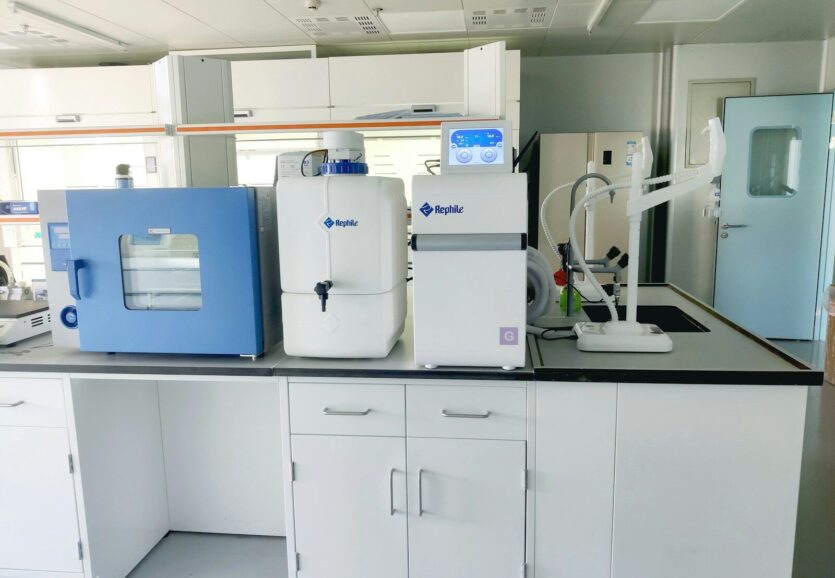 a room with white cabinets and blue cabinets